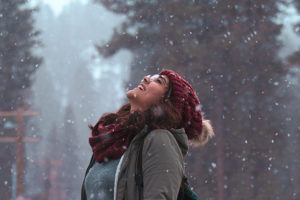 woman smiling in snow