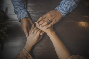 Holding hands over table