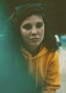 girl in yellow sweatshirt