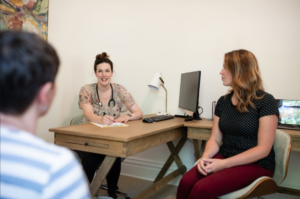 Staff talking in office