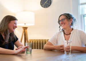 staff talking at table