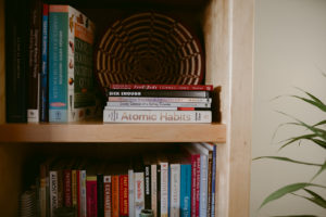 Book shelf featuring the book atomic habits