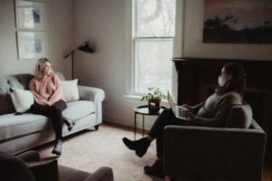 Woman sitting on a couch during a therapy session